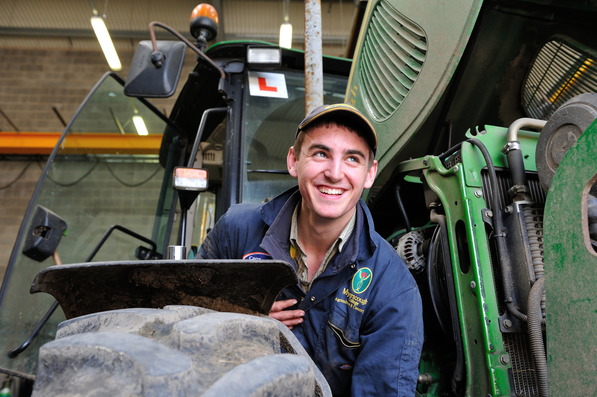 Myerscough College Agriculture student inspects a tractor