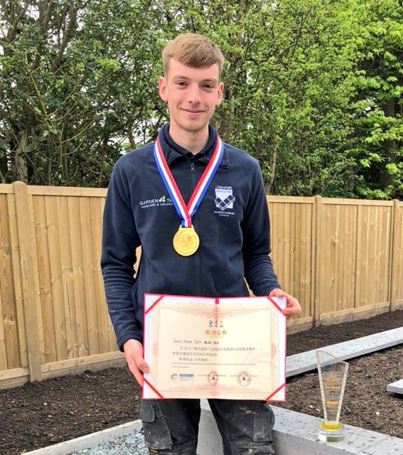 Colin with his certificate