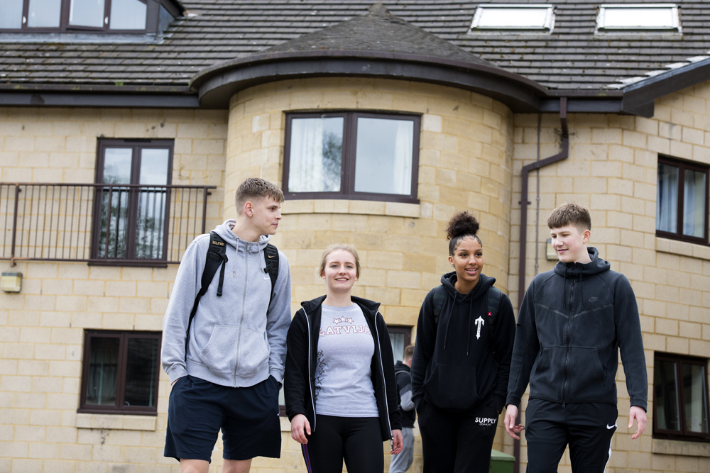 Myerscough College students walking outside a halls of residence.